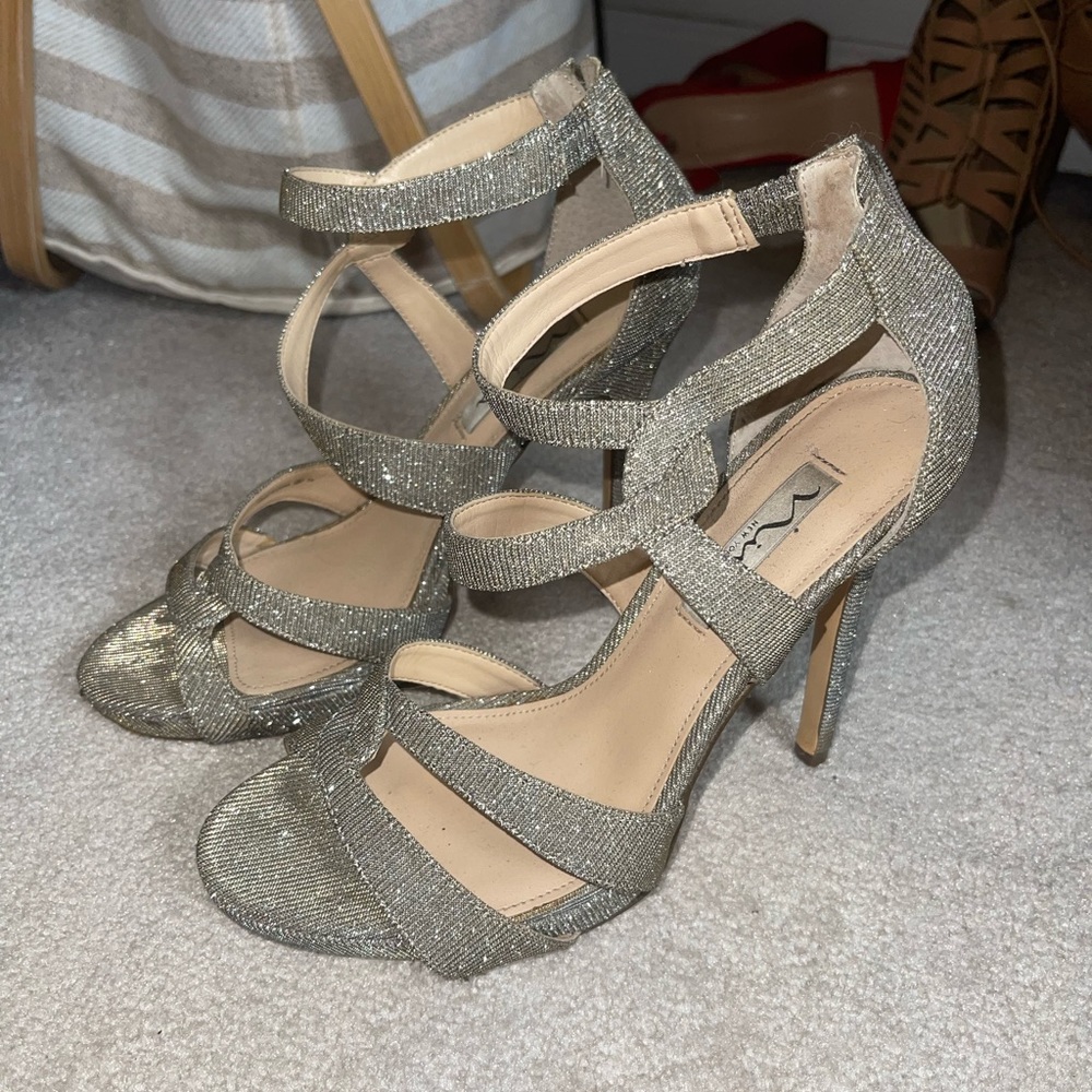 Sparkly high heels. Size 7.5. Worn but in great condition.